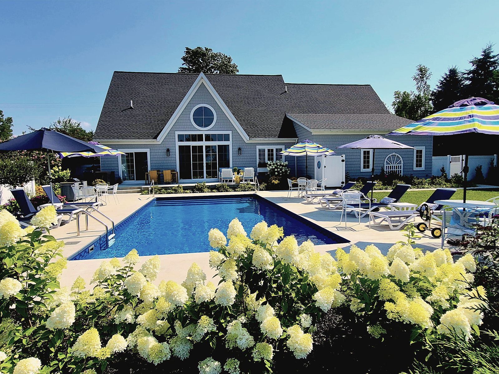 Summerset Cottage & Suites private heated saltwater pool and grounds in Douglas, Michigan